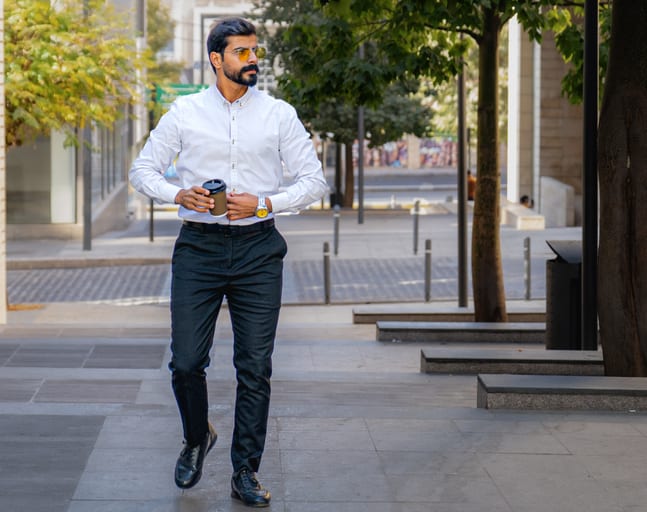 MAN Walking Drink Coffee, a fine-art photograph by Ali Abu Ras