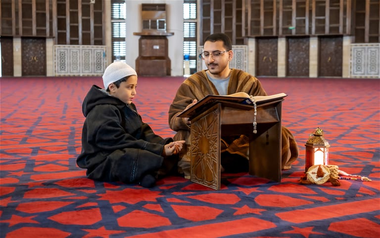 1 BOY Father Masjed Quran Zoom, a fine-art photograph by Ali Abu Ras