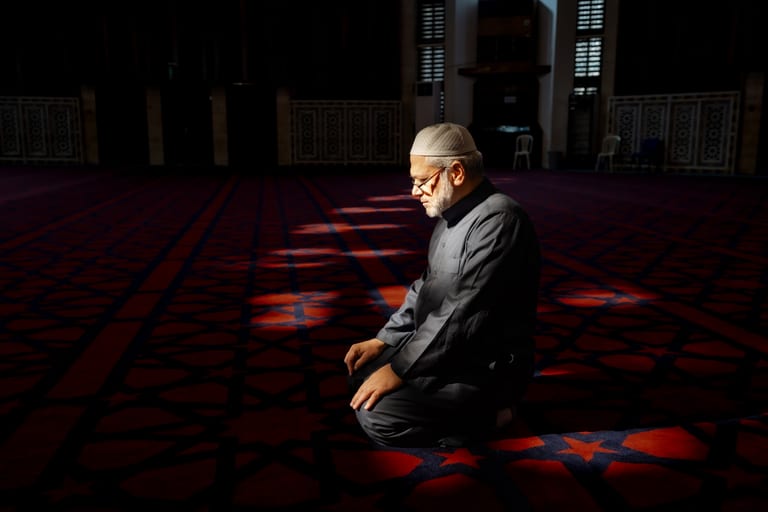 MAN Read Quran Masjid Ramadain, a fine-art photograph by Ali Abu Ras