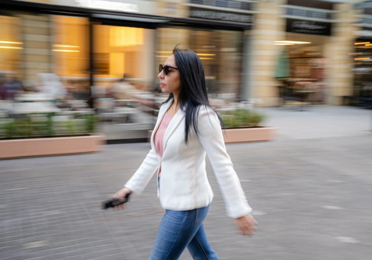 Woman Walking Speed Motion, a fine-art photograph by Ali Abu Ras