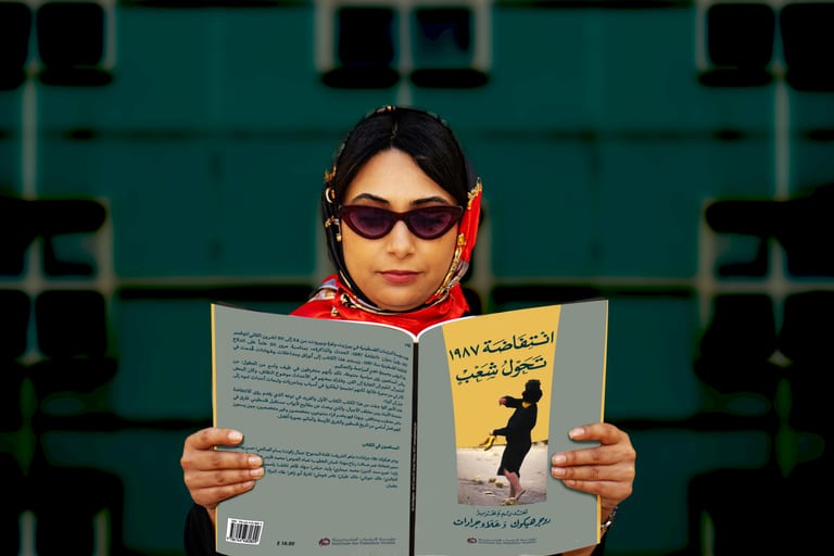 Woman Read Magazen Building Glasses, a fine-art photograph by Ali Abu Ras