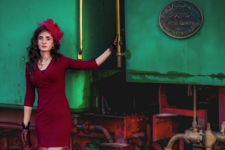 Noor RED Dress Train Scaled, a fine-art photograph by Ali Abu Ras