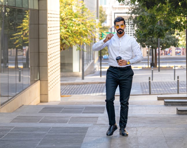 MAN Walking Drink Coffee, a fine-art photograph by Ali Abu Ras