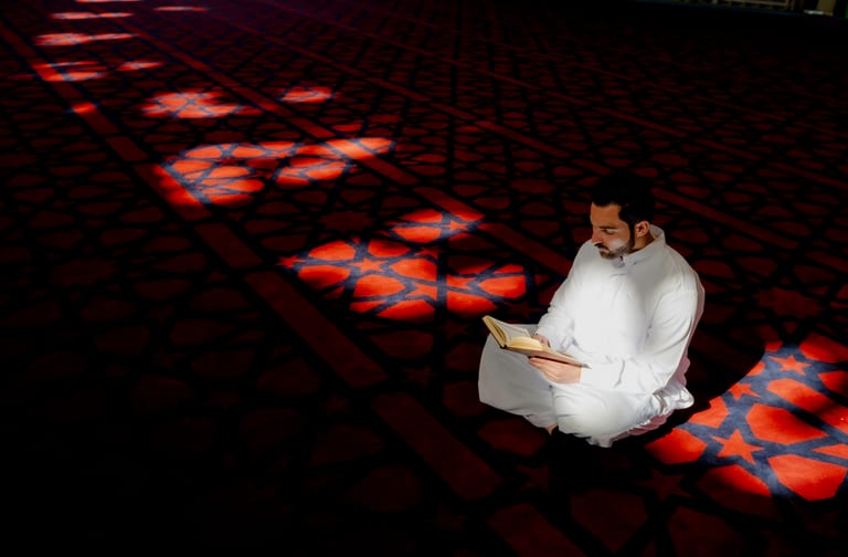 1 MAN Read Quran Masjid Ramadain, a fine-art photograph by Ali Abu Ras