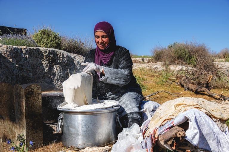 Woman Work Create Bread Outdoor Graesa, a fine-art photograph by Ali Abu Ras