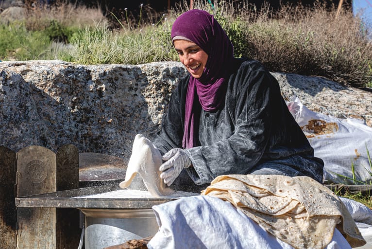 Woman Work Create Bread Outdoor Graesa, a fine-art photograph by Ali Abu Ras
