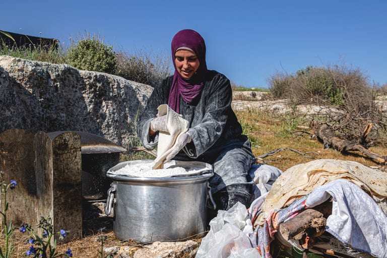Woman Work Create Bread Outdoor Graesa, a fine-art photograph by Ali Abu Ras
