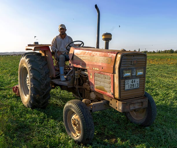 Farmer Trucktor Hashmiah, a fine-art photograph by Ali Abu Ras