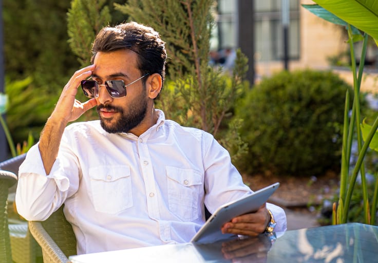 MAN Woman Laptop Table Outdoor, a fine-art photograph by Ali Abu Ras