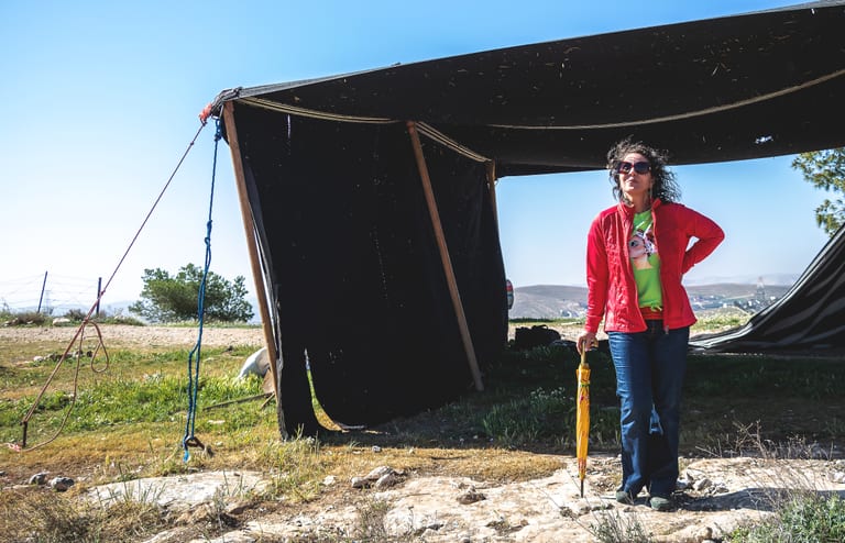 Woman Bedwen Position Tent Garesa, a fine-art photograph by Ali Abu Ras