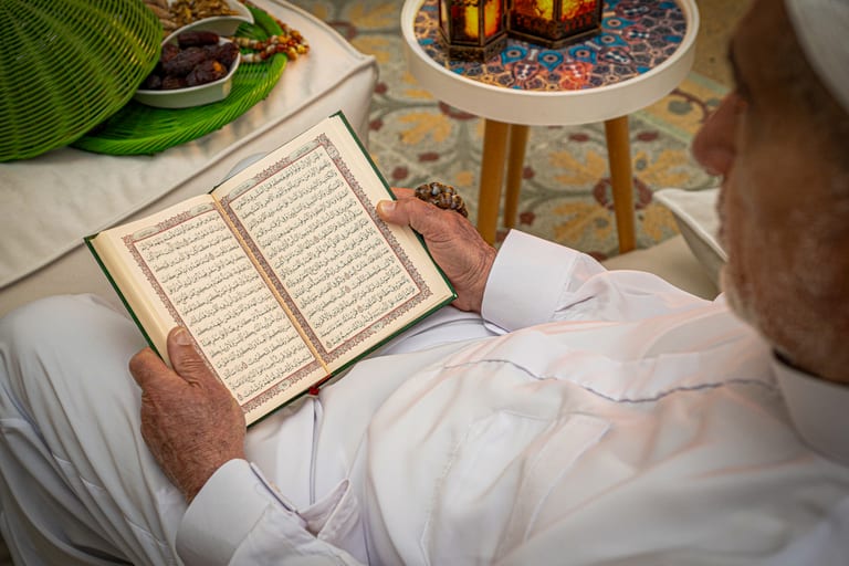 MAN OLD Read Quran Ramadan City Background, a fine-art photograph by Ali Abu Ras