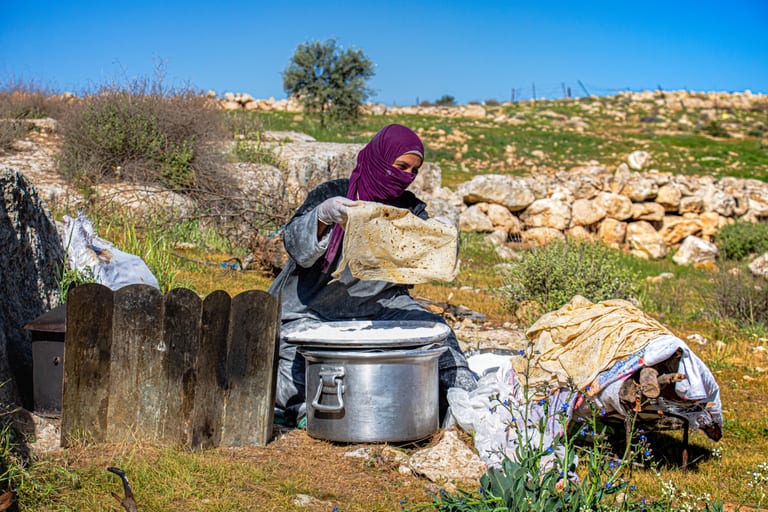 Woman Work Create Bread Outdoor Graesa, a fine-art photograph by Ali Abu Ras