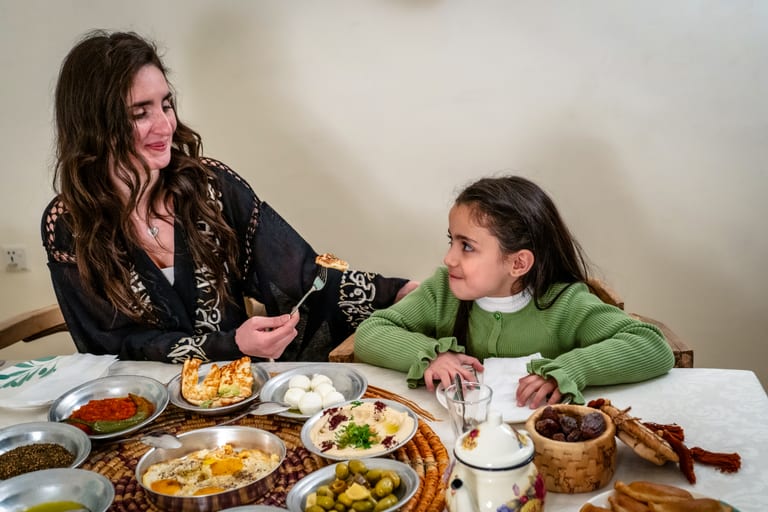Ramadan Woman Noor Eftar Sohour, a fine-art photograph by Ali Abu Ras