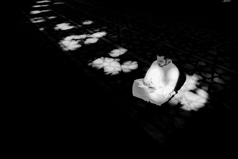 MAN Read Quran Masjid Ramadain, a fine-art photograph by Ali Abu Ras