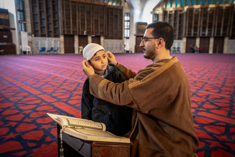BOY Father Masjed Quran, a fine-art photograph by Ali Abu Ras