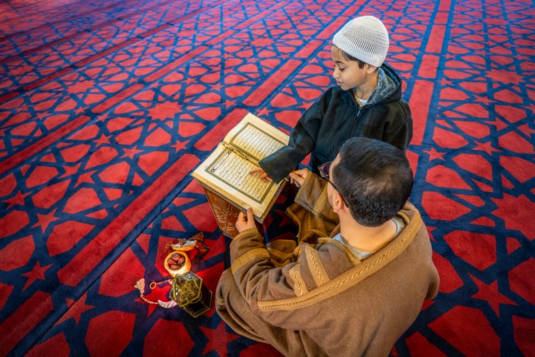BOY Father Masjed Quran, a fine-art photograph by Ali Abu Ras