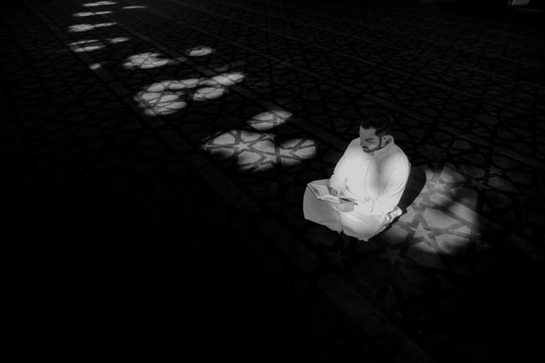 MAN Read Quran Masjid Ramadain, a fine-art photograph by Ali Abu Ras