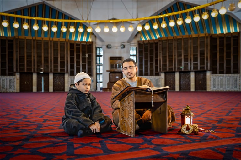 BOY Father Masjed Quran, a fine-art photograph by Ali Abu Ras