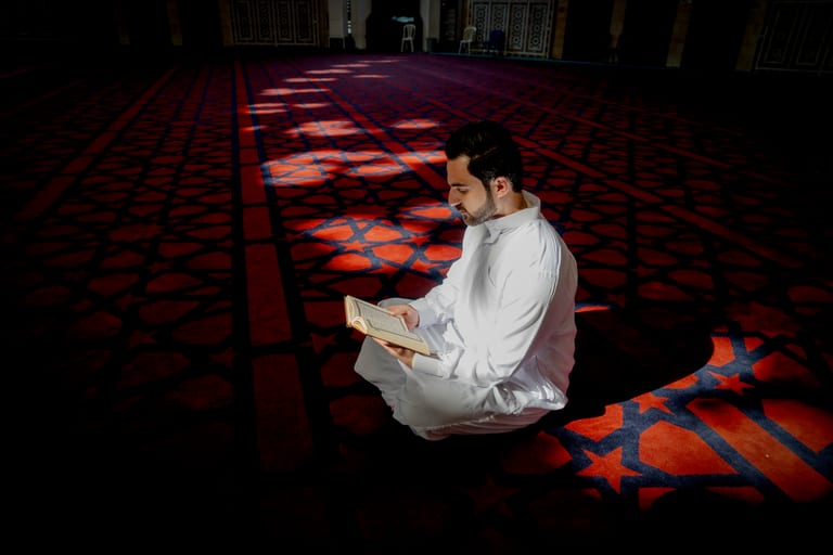 MAN Read Quran Masjid Ramadain, a fine-art photograph by Ali Abu Ras