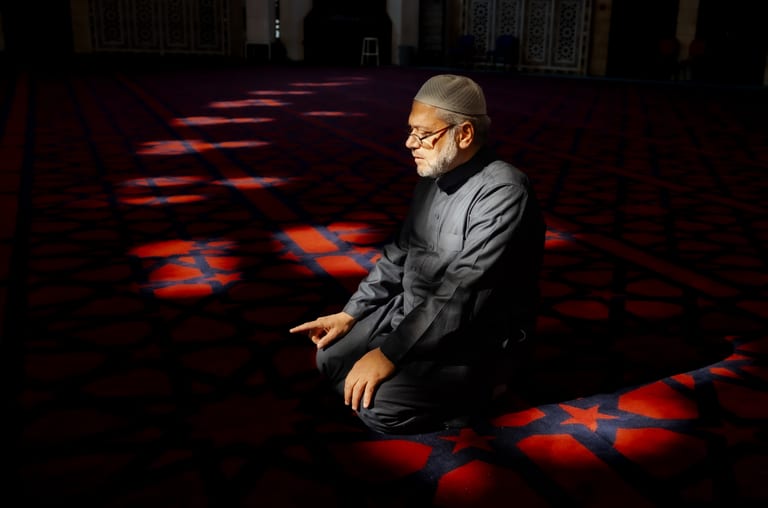 MAN Read Quran Masjid Ramadain, a fine-art photograph by Ali Abu Ras