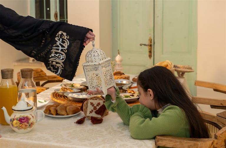 Light Girle Woman Hand Table Ramadan, a fine-art photograph by Ali Abu Ras