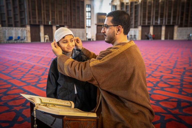 BOY Father Masjed Quran, a fine-art photograph by Ali Abu Ras