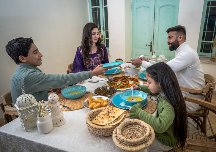 Family Ramadan Eftar Food Eating, a fine-art photograph by Ali Abu Ras