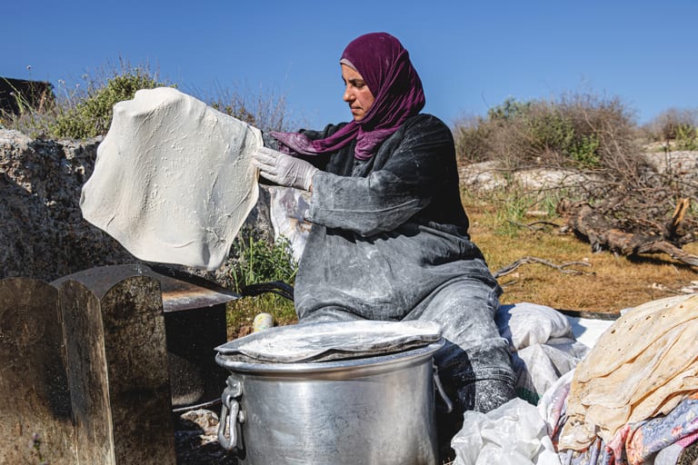 Woman Work Create Bread Outdoor Graesa, a fine-art photograph by Ali Abu Ras